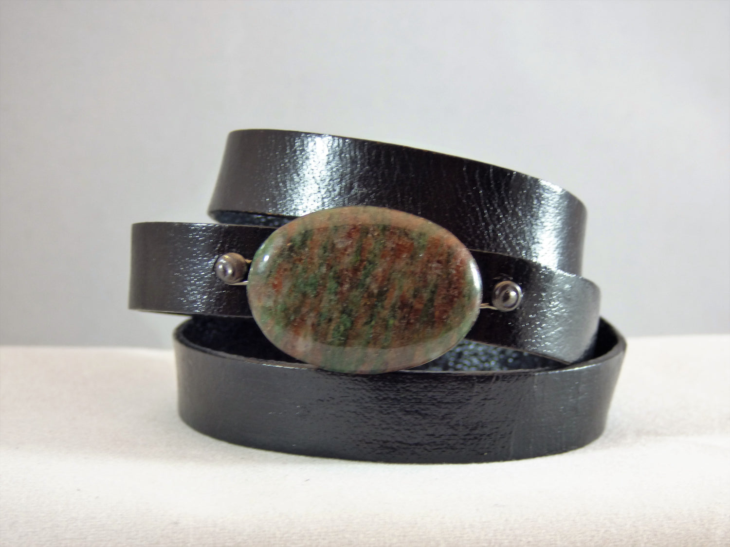 Leather wrap with a ruby in Kyanite